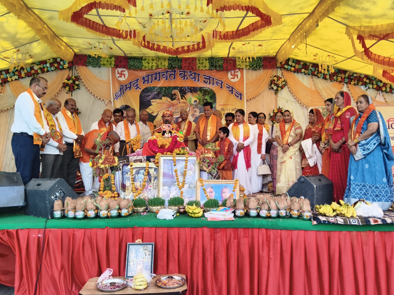 Devotees attending Shrimad Bhagwat Katha at Narmadeshwar Mahadev Temple in Dewas with Acharya Yadram Shastri speaking