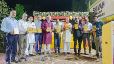 Guests releasing the autobiography Anand se Anar Tak by Dr. Anarsingh Thakur at Dewas event