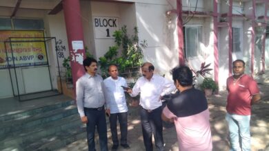 Divisional observer inspecting PSC exam center arrangements in Dewas