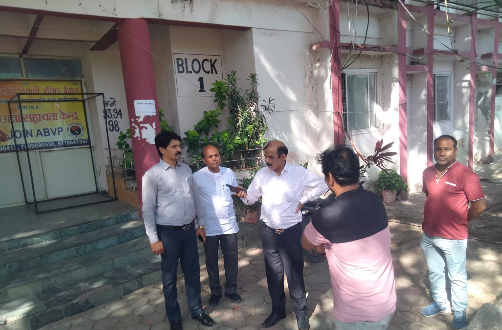 Divisional observer inspecting PSC exam center arrangements in Dewas