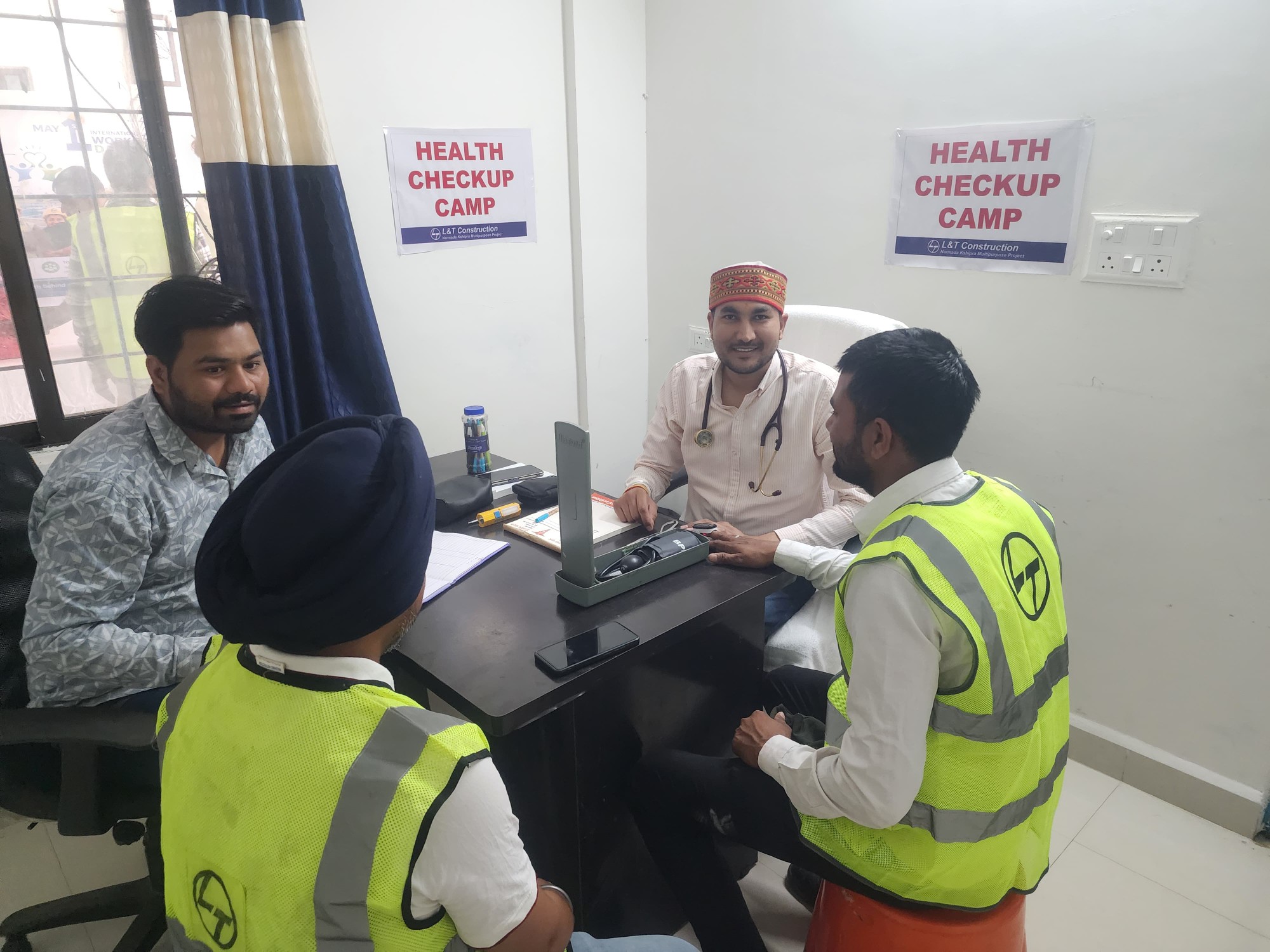 doctor checking workers in free health camp on labour day in India